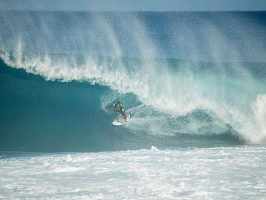 surfer getting barreled